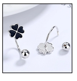 Macro shot of 925 silver black clover stud earrings with S925 hallmark and ball screw backs