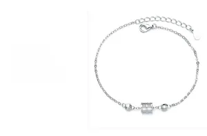 Macro detail of S925 sterling silver cylinder charm bracelet with lobster clasp