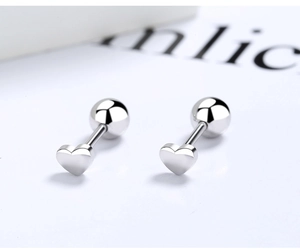 Macro shot of 925 silver heart stud earrings with secure screw-back ball closures
