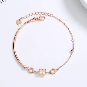 Elegant rose gold S925 silver bracelet featuring a cylindrical charm and heart pendant