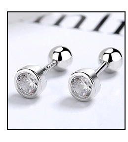 Detailed macro view of S925 sterling silver screw back earrings with round cubic zirconia