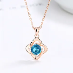925 silver four-leaf clover necklace with round blue topaz pendant in rose gold finish