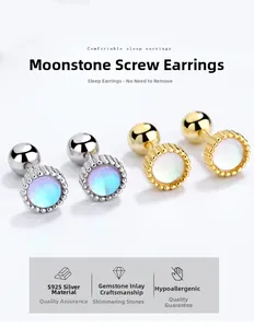 Macro shot of S925 silver moonstone screw back earrings in gold and silver finish