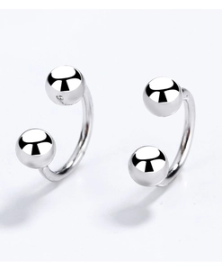 Detailed view of silver 925 sterling silver U-shaped earrings with polished metal beads