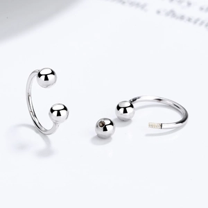 Minimalist S925 silver U-shaped horseshoe earrings with polished beads on white background