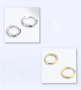 Détail des boucles d'oreilles créoles en argent 925 en finitions dorée et argentée