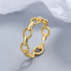 Detailed macro view of S925 sterling silver chain ring with adjustable open band and gold finish