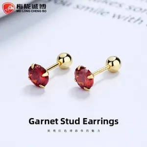 Macro detail of red garnet stud earring with S925 silver stamp and golden screw back