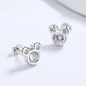 Macro shot of 925 sterling silver Mickey Mouse stud earrings set with sparkling zircons