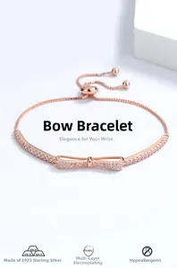 Detail view of rose gold S925 sterling silver bow bracelet with cubic zirconia and slide clasp