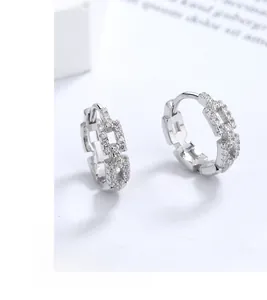 Detailed close-up of S925 silver Cuban link earrings with sparkling cubic zirconia inlay