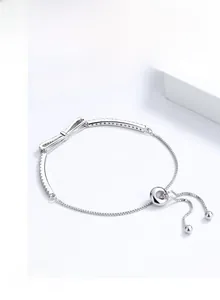 Detail view of S925 silver bow bracelet with zircons and adjustable slider clasp