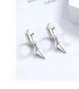 Macro shot of 925 silver conical spike hoop earrings with smooth electroplated finish