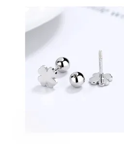 Macro shot of 925 sterling silver four-leaf clover earrings with secure screw-back design