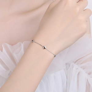 Elegant 925 sterling silver heart charm bracelet for women featuring a minimalist link design