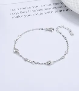 Macro shot of 925 silver bracelet featuring round cubic zirconia and lobster clasp