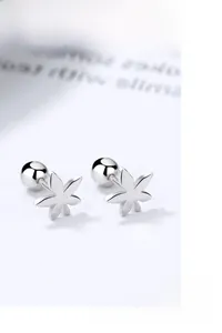 Detailed macro view of S925 sterling silver hollow maple leaf studs with screw backings