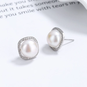 Elegant S925 sterling silver stud earrings with round freshwater pearl and zircon halo