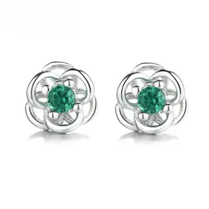 Detail of 925 silver flower stud earrings with a round green gemstone and hollow petals