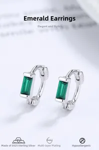 Detail view of 925 sterling silver hoop earrings featuring rectangular green zircon stones