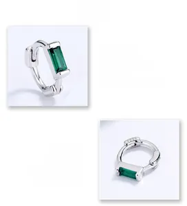 Macro view of S925 sterling silver earrings with green zircon and side hallmark