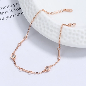 Rose gold S925 silver bracelet with circular zircons on white porcelain tray