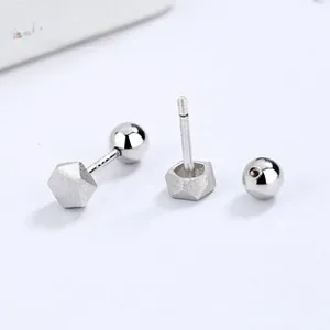 Detailed view of hexagonal 925 silver stud earrings with screw back balls and matte finish
