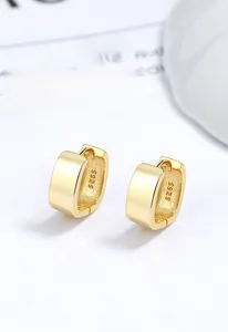 Macro shot of S925 hallmark on the inner band of gold plated square hoop earrings