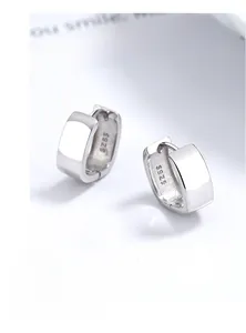 Macro shot of 925 sterling silver rectangular earrings with visible S925 hallmark stamp