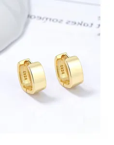 Macro shot of S925 hallmark on square gold vermeil hoop earrings with polished finish