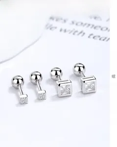 Macro shot of 925 sterling silver square zircon stud earrings with secure screw back closure