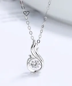 Detailed close-up of S925 silver necklace featuring a dancing stone and wing design