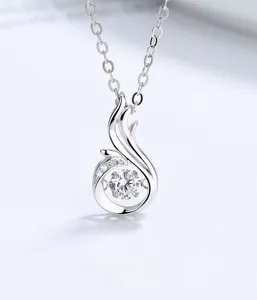 Detailed close-up of S925 sterling silver phoenix pendant with dancing stone flickering