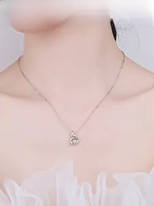 S925 silver phoenix heart necklace with sparkling zircon stone on a model neck