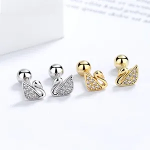 Macro shot of swan stud earrings with white zircon paving and spherical screw backs