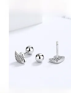 Macro shot of 925 sterling silver swan studs with zircon pavé and screw back closure