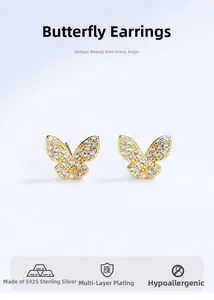 Macro view of butterfly earrings with micro-paved zircons in a gold plated silver finish