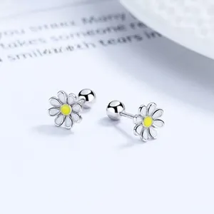 Macro detail of S925 silver daisy earrings with white enamel petals and screw-back closure