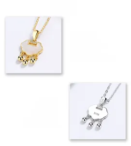Macro detail of S925 sterling silver stamp on golden and silver Ruyi lock necklaces