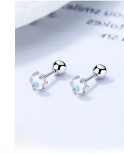 Macro shot of S925 sterling silver moonstone stud earrings with screw-back design