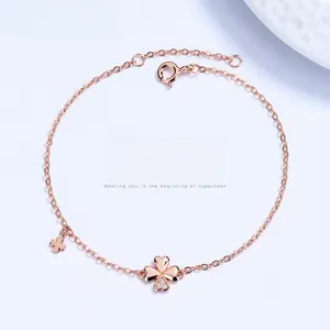 Close-up of rose gold clover bracelet with sparkling zircons and adjustable chain
