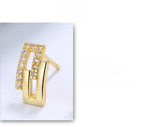 Macro detail of geometric S925 sterling silver earring with cubic zirconia stones