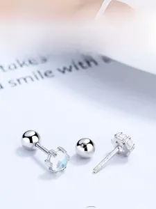 Macro view of S925 sterling silver moonstone stud earrings with secure screw back