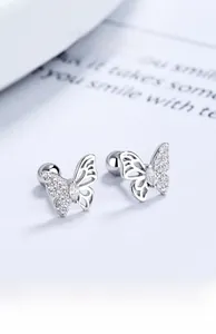 Macro shot of 925 sterling silver butterfly stud earrings with sparkling cubic zirconia