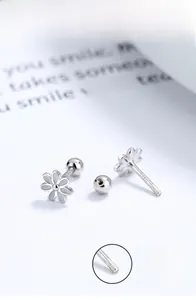 Macro view of S925 sterling silver daisy earrings featuring a secure screw back design