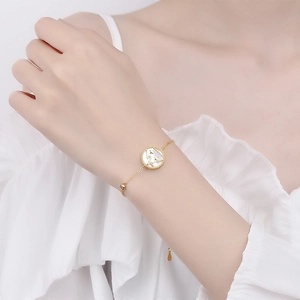 925 silver zodiac bracelet with gold plating, white shell pendant and star moon detail