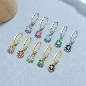 Detailed macro of 925 sterling silver flower earrings with colorful zircon stones set