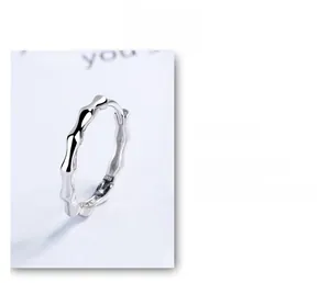 Close-up of 925 sterling silver hoop earring with textured bamboo joint pattern