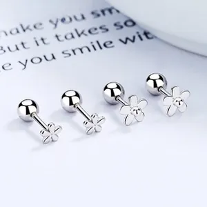 Macro detail of 925 sterling silver flower stud earrings with secure screw back closure