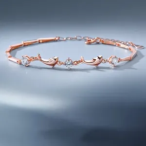 Close-up of S925 sterling silver dolphin bracelet with rose gold plating and crystals